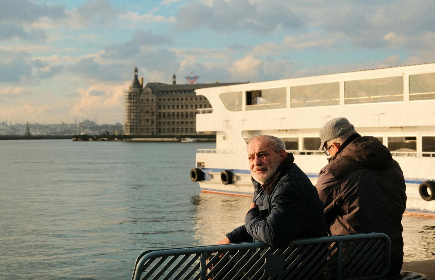 Elderly men looking out to sea